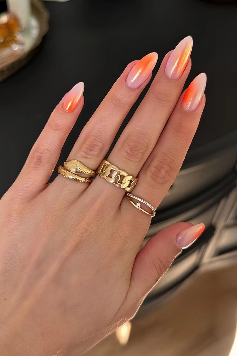Chrome orange blended nails with aurora effect