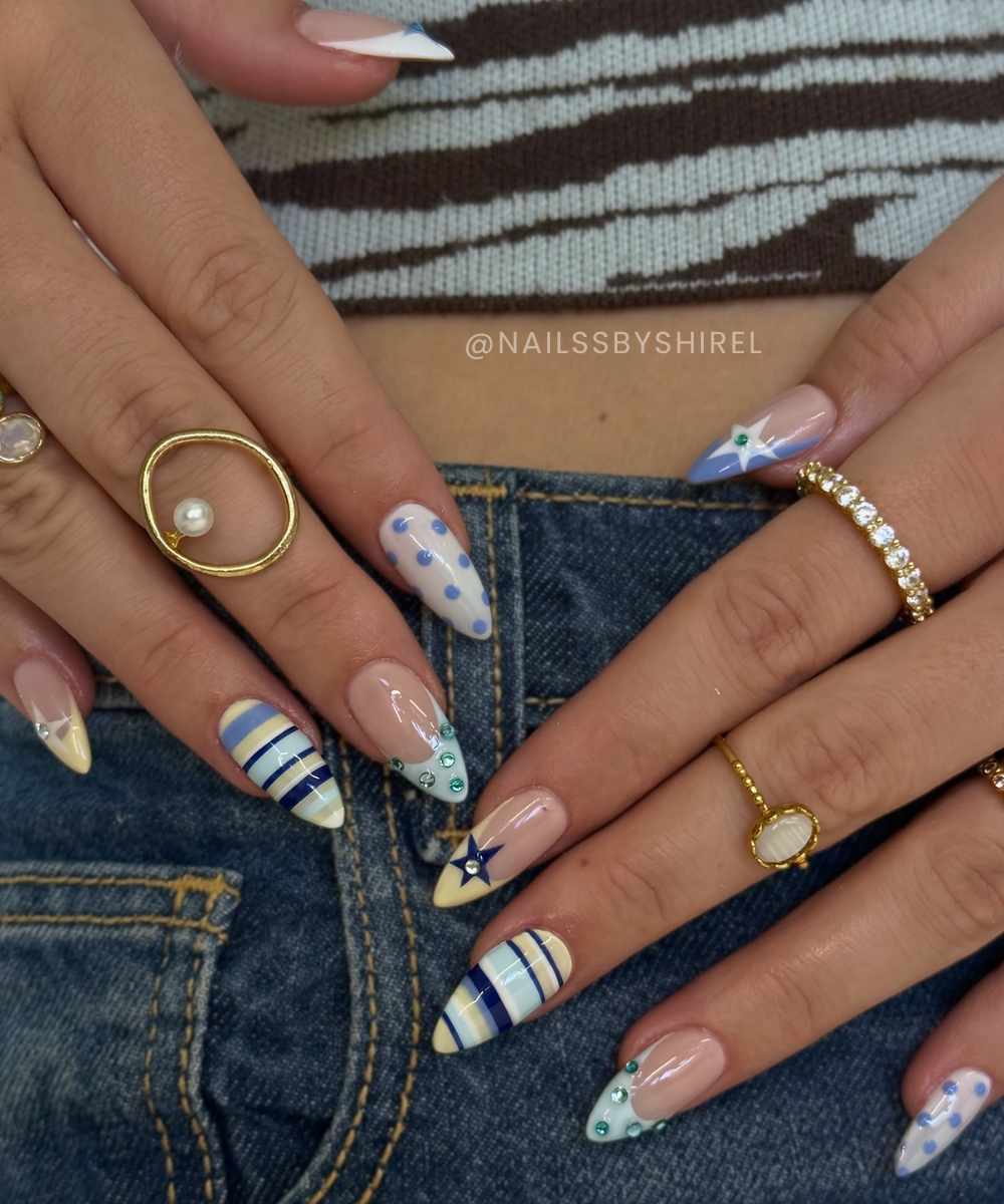 Colorful nails with mixed pattern art and gems
