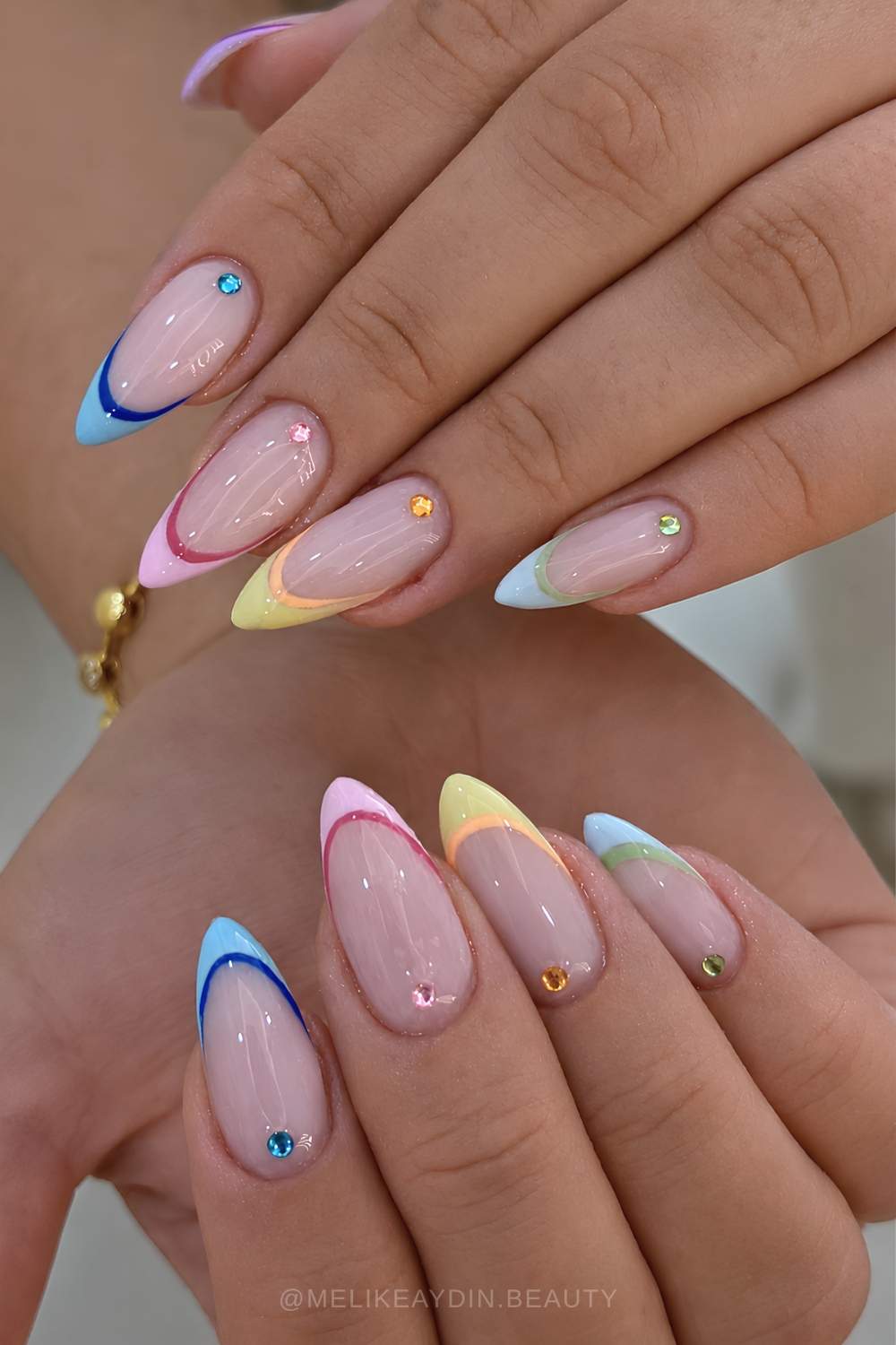 Colorful outlined French tips with cuticle gems