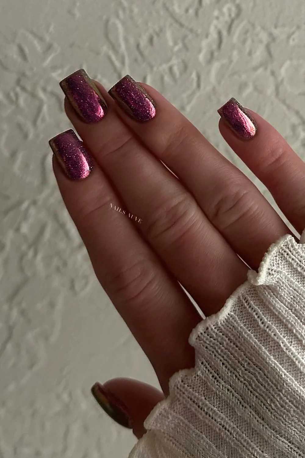 Dark pink glitter nails with chrome finish