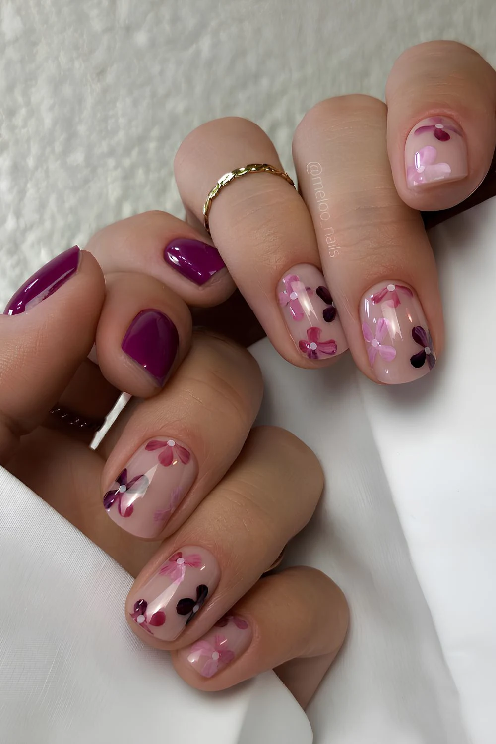 Deep mauve nails with floral art