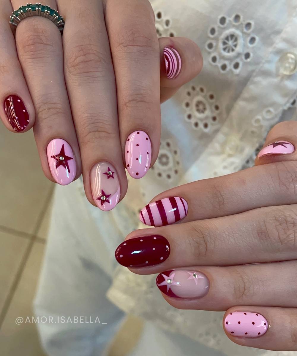Deep red and pink mani with stripes and stars
