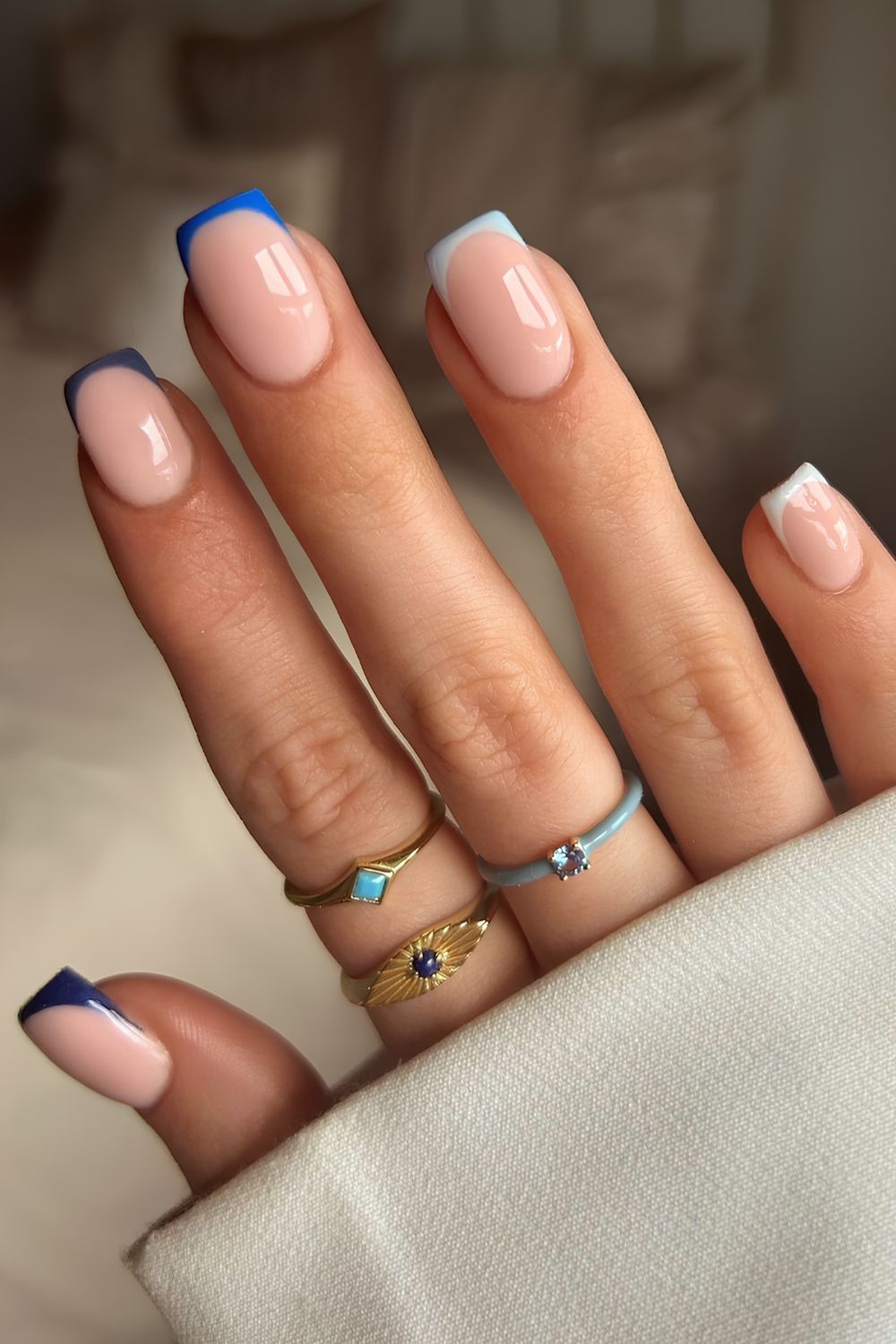 French tips in different shades of blue