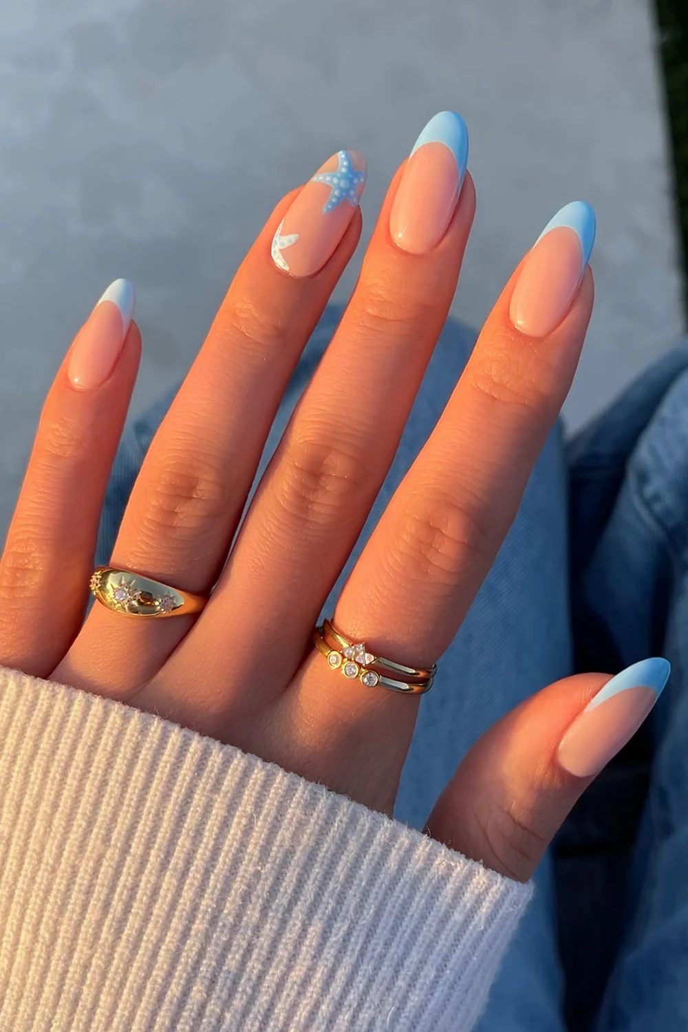 Light blue French mani with starfish accent