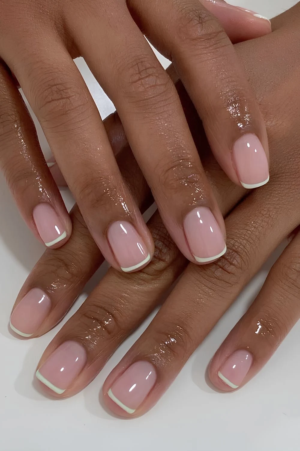 Milky pink base with white micro French tip nails
