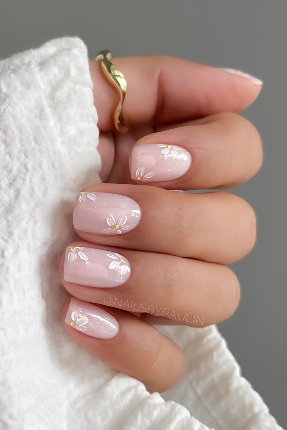 Milky white nails with glitter and brush stroke floral design