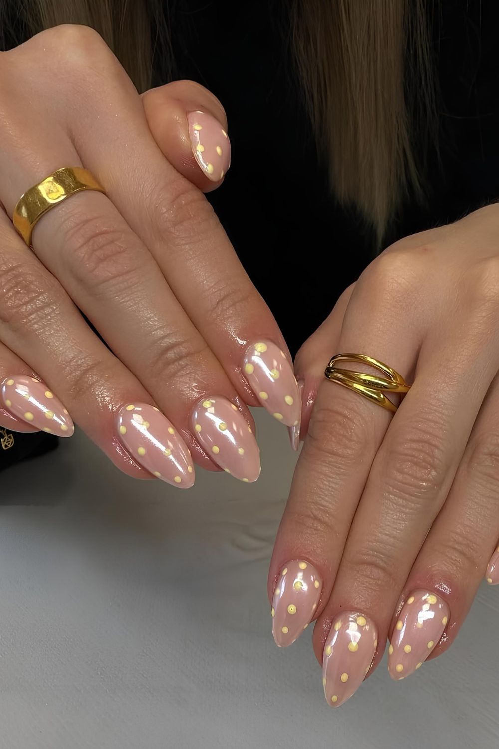 Neutral glazed nails with yellow polka dots