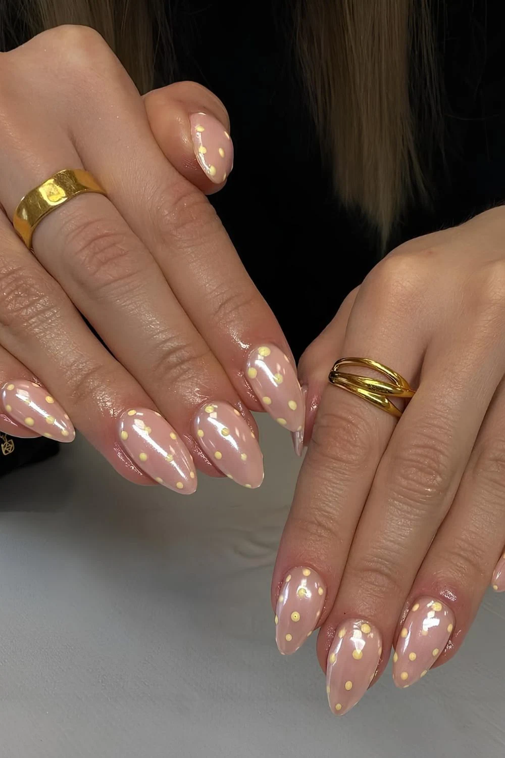 Neutral glazed nails with yellow polka dots