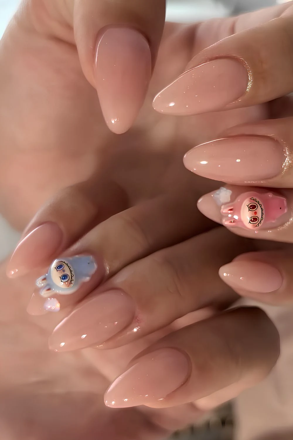 Neutral manicure with labubu accents