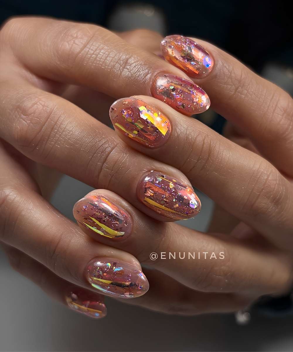 Orange and gold aurora nails with holographic details