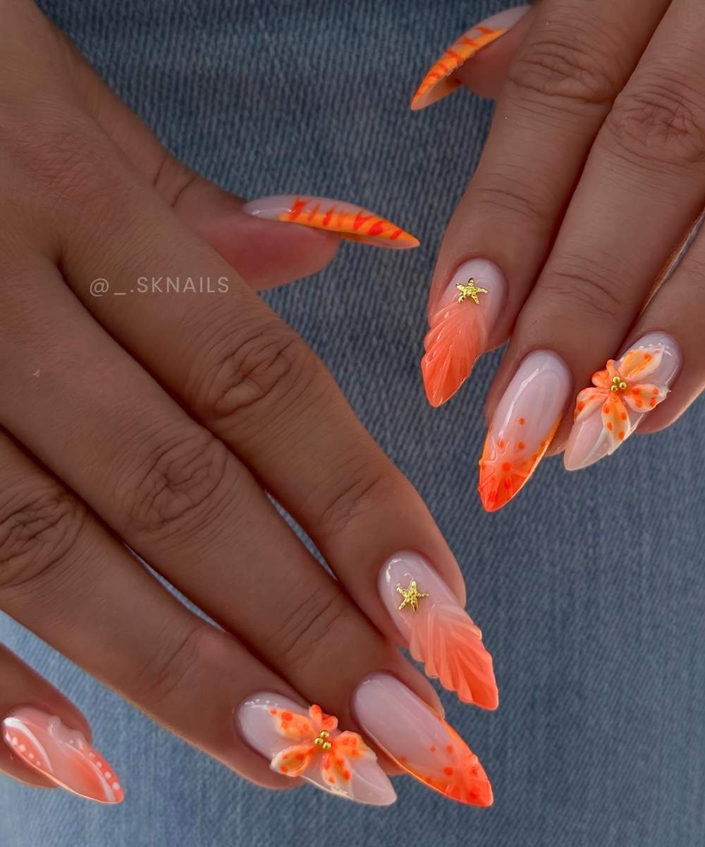 Orange nails with seashells and flowers