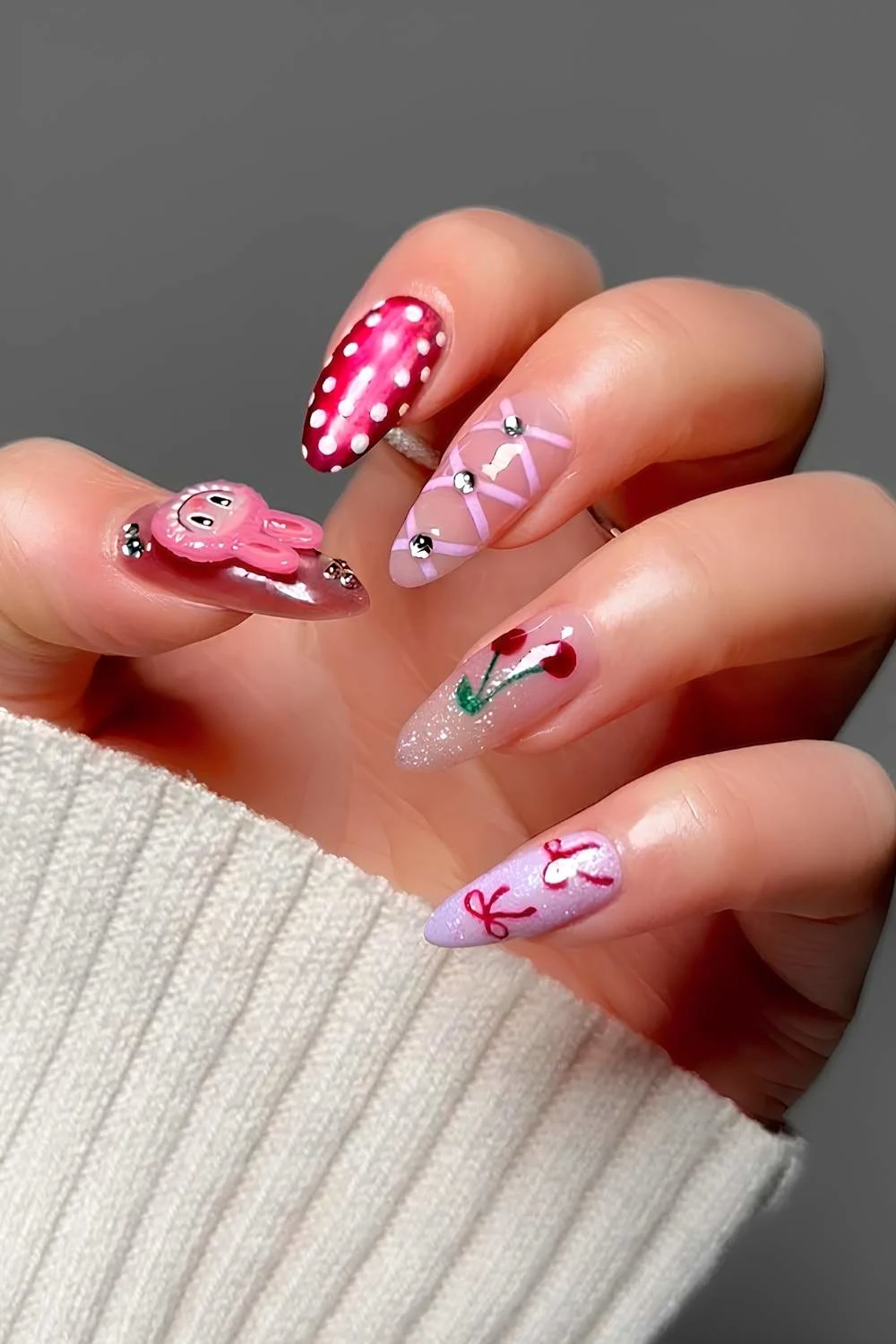 Pink and red mix and match nails with labubu accents