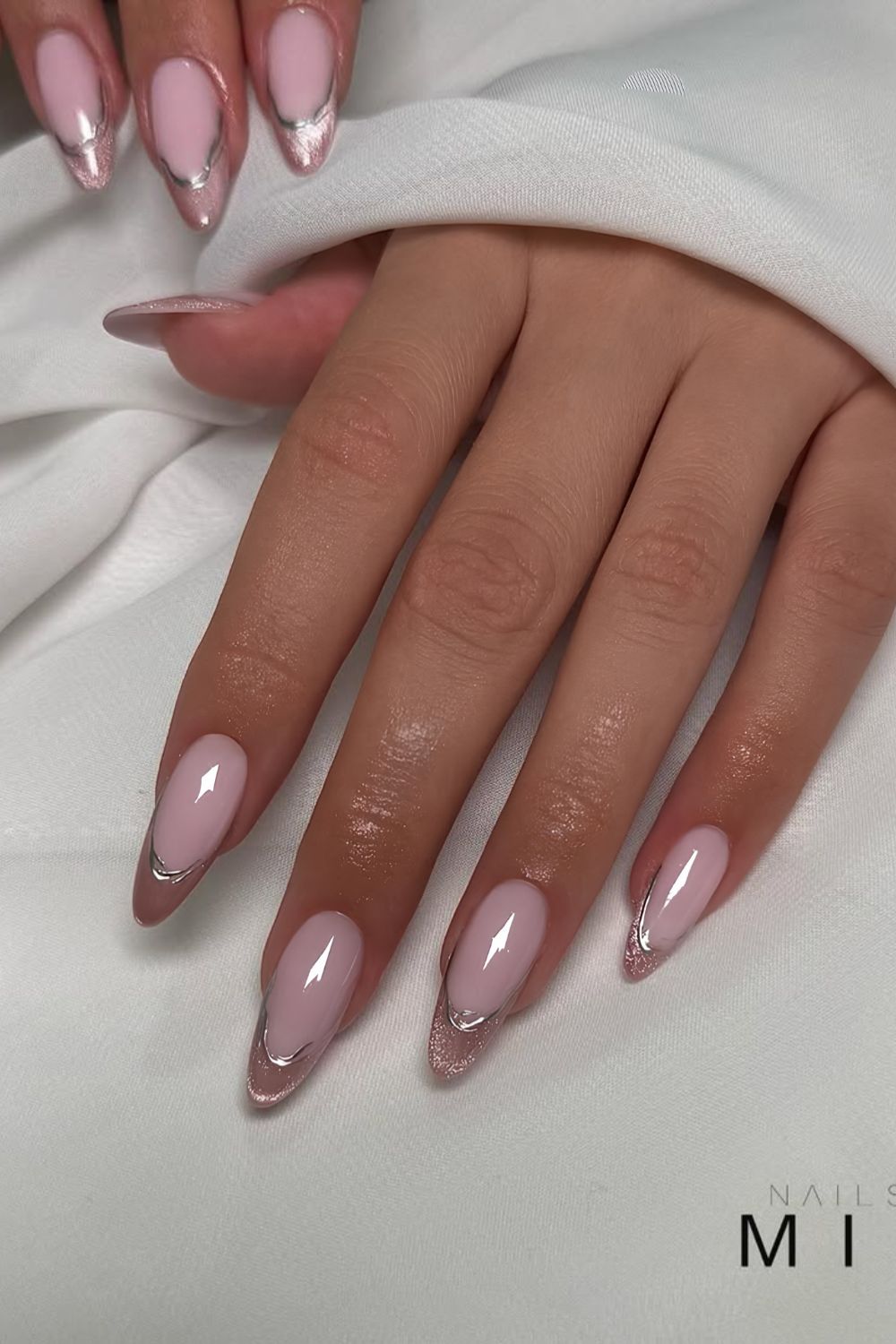 Pink cat-eye French nails with silver chrome outlines