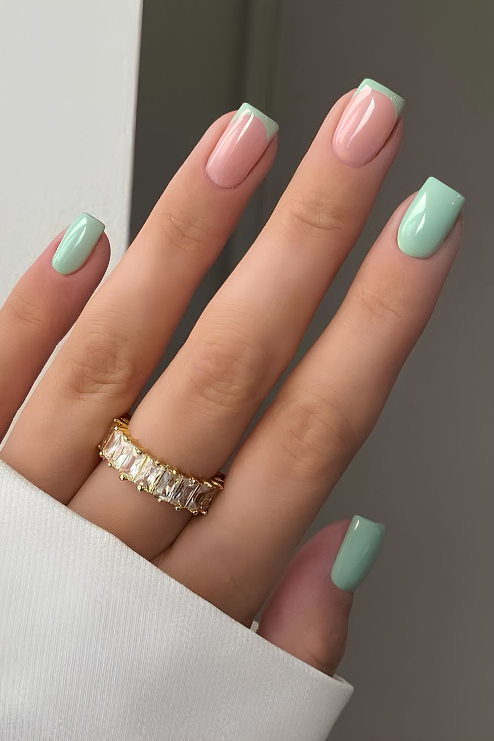 Sage green nails with accent French tips