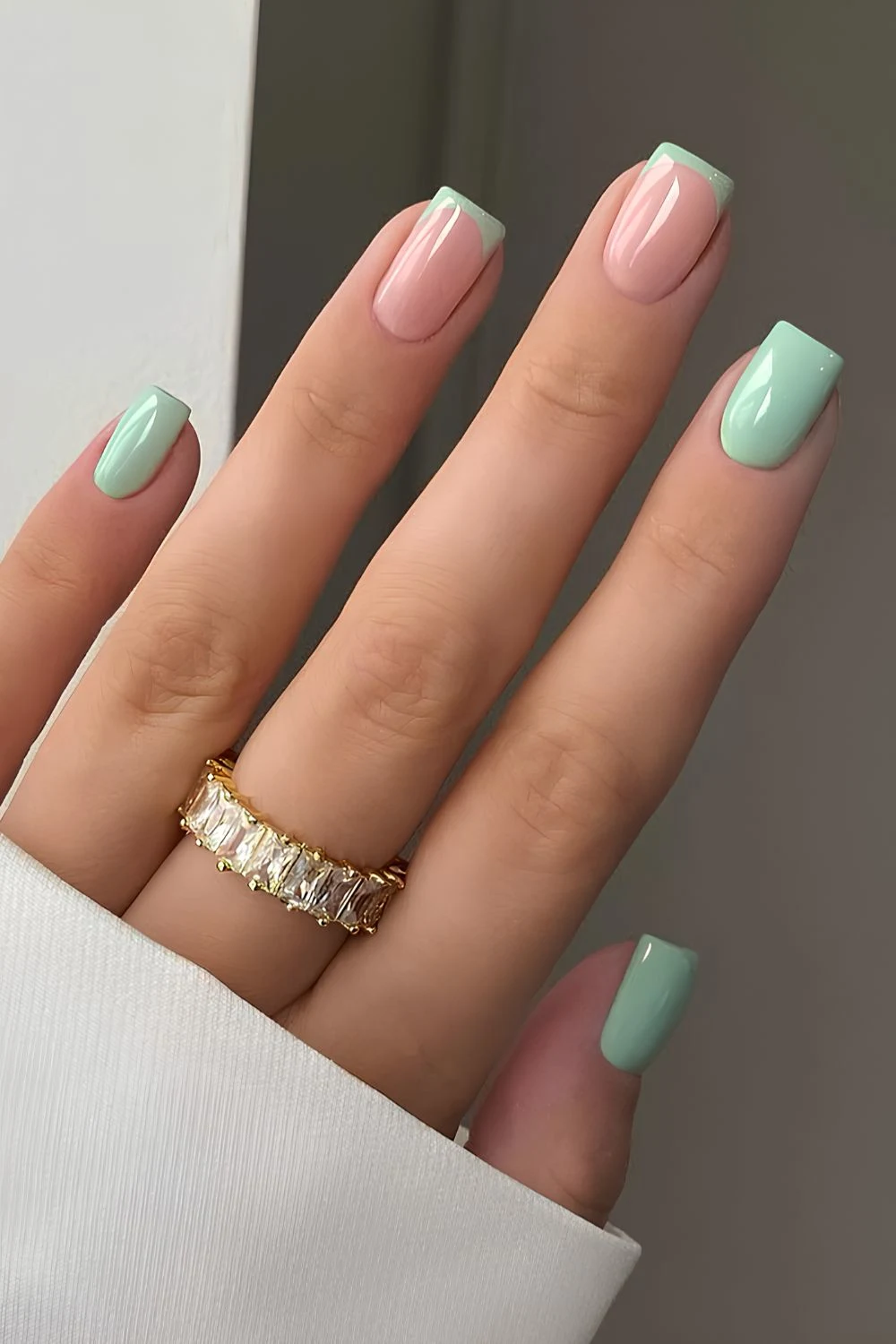 Sage green nails with accent French tips