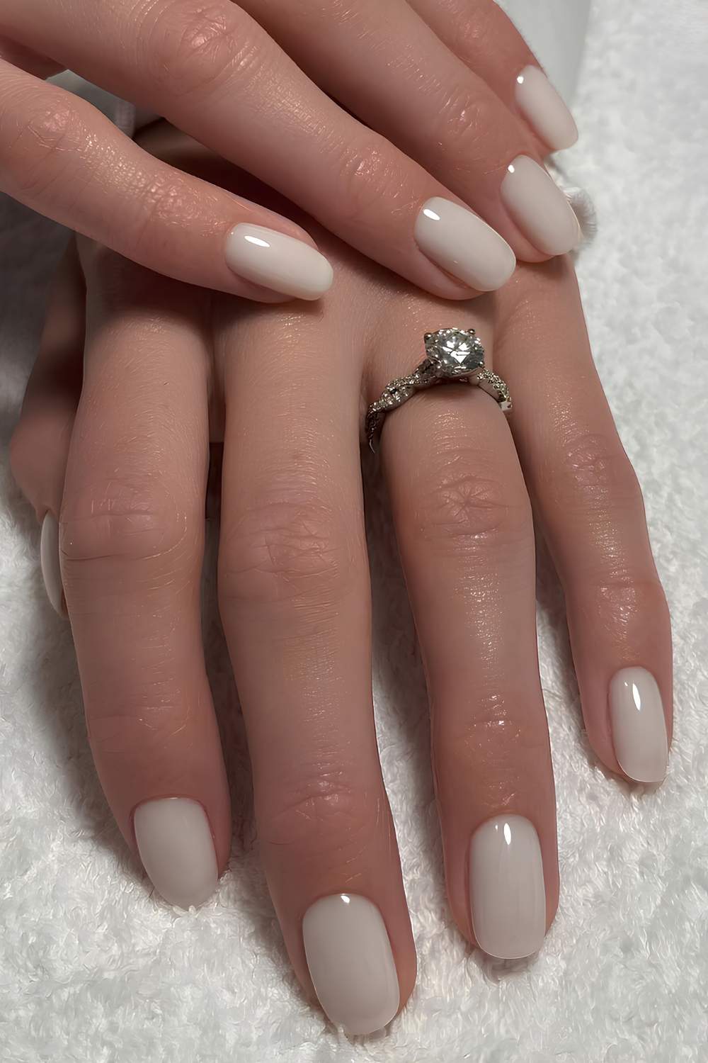 Short and oval milky white manicure