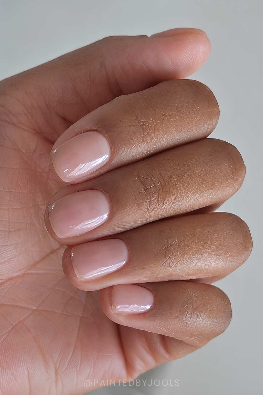 Short and sheer nude manicure