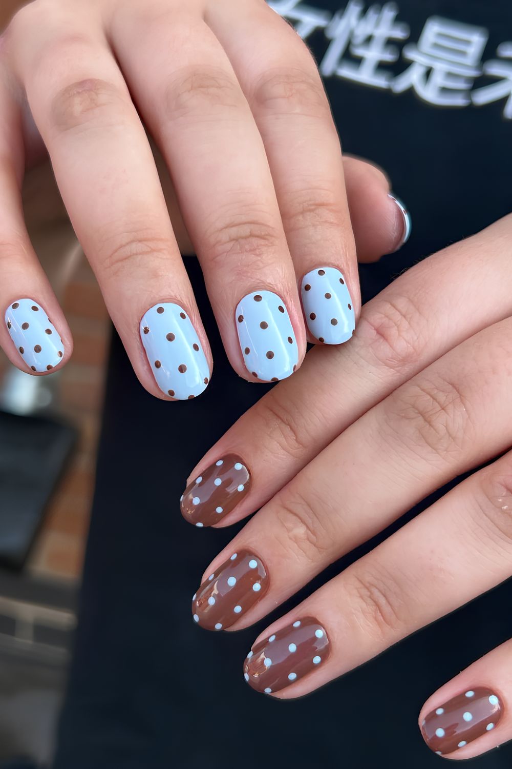 Short blue and brown nails with polka dots