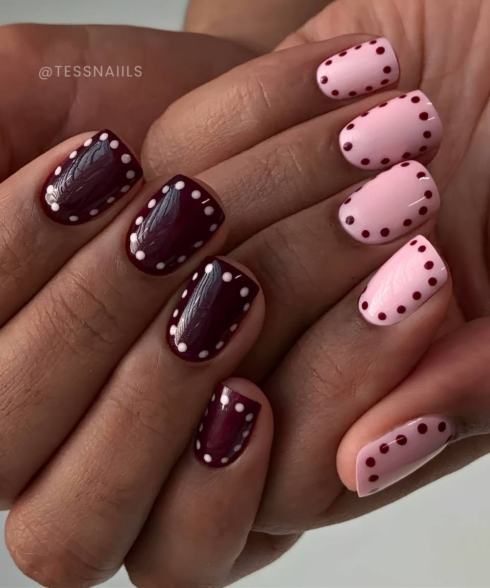 Short burgundy and pink dotted halo nails