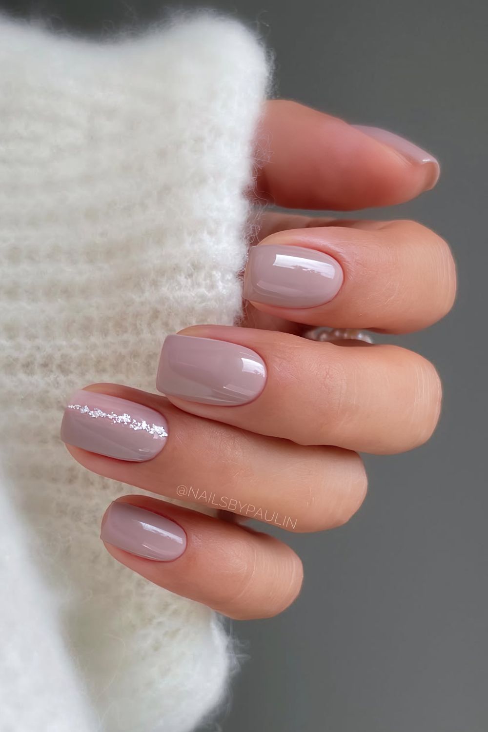 Short mauve nails with glittery silver line accent
