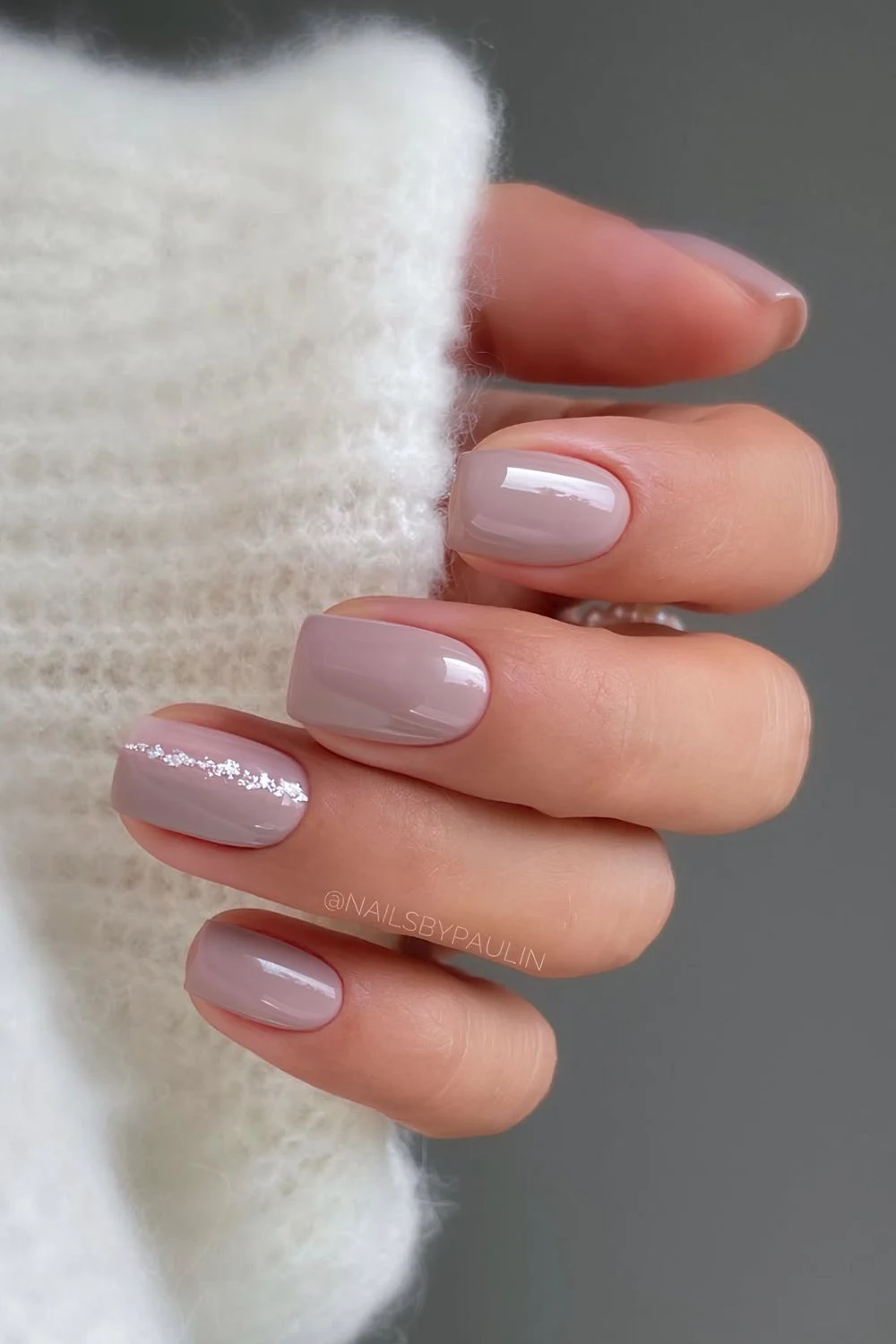 Short mauve nails with glittery silver line accent