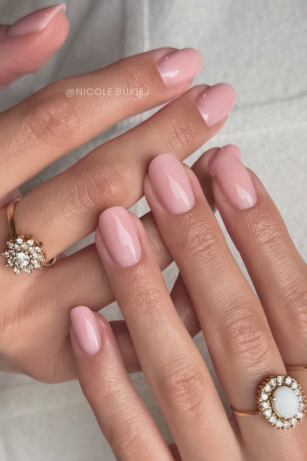 Short rounded milky pink nails