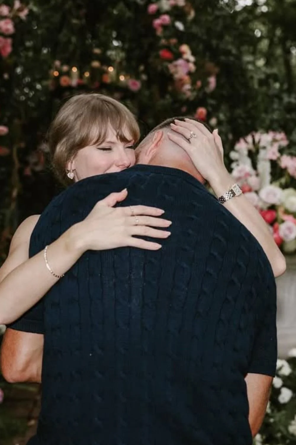 Taylor Swift and Travis Kelce engagement photo with her engagement nails visible