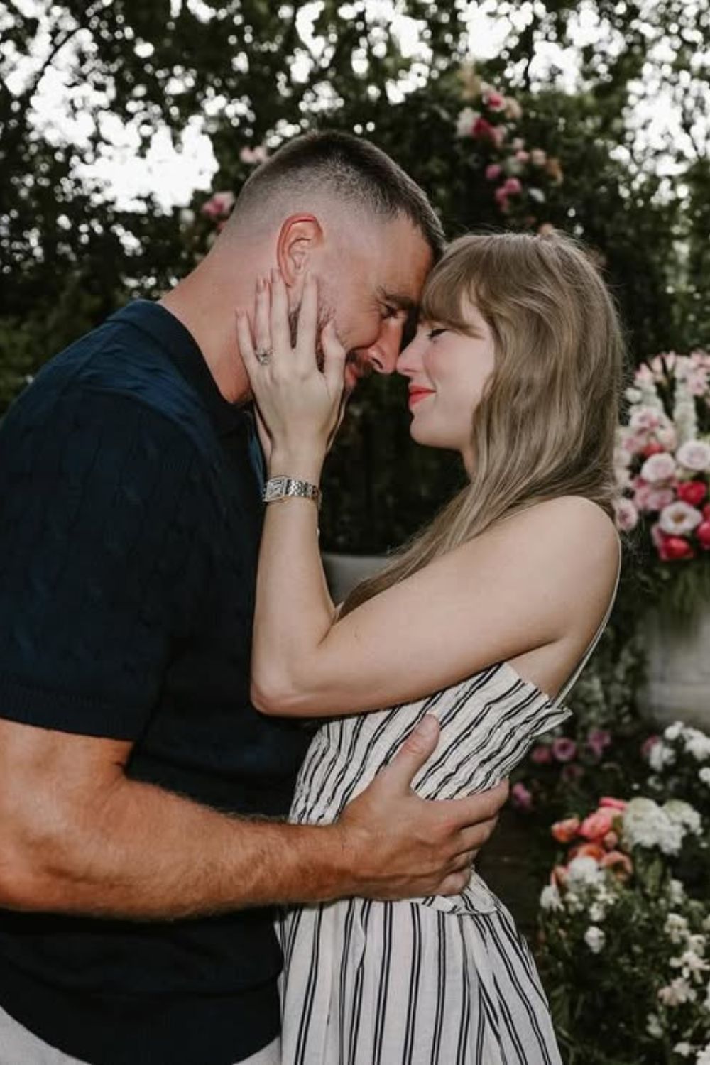 Taylor Swift and Travis Kelce engagement photo with her nails visible