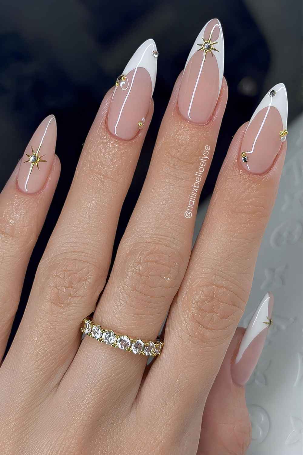 White French tips with pearls and celestial art