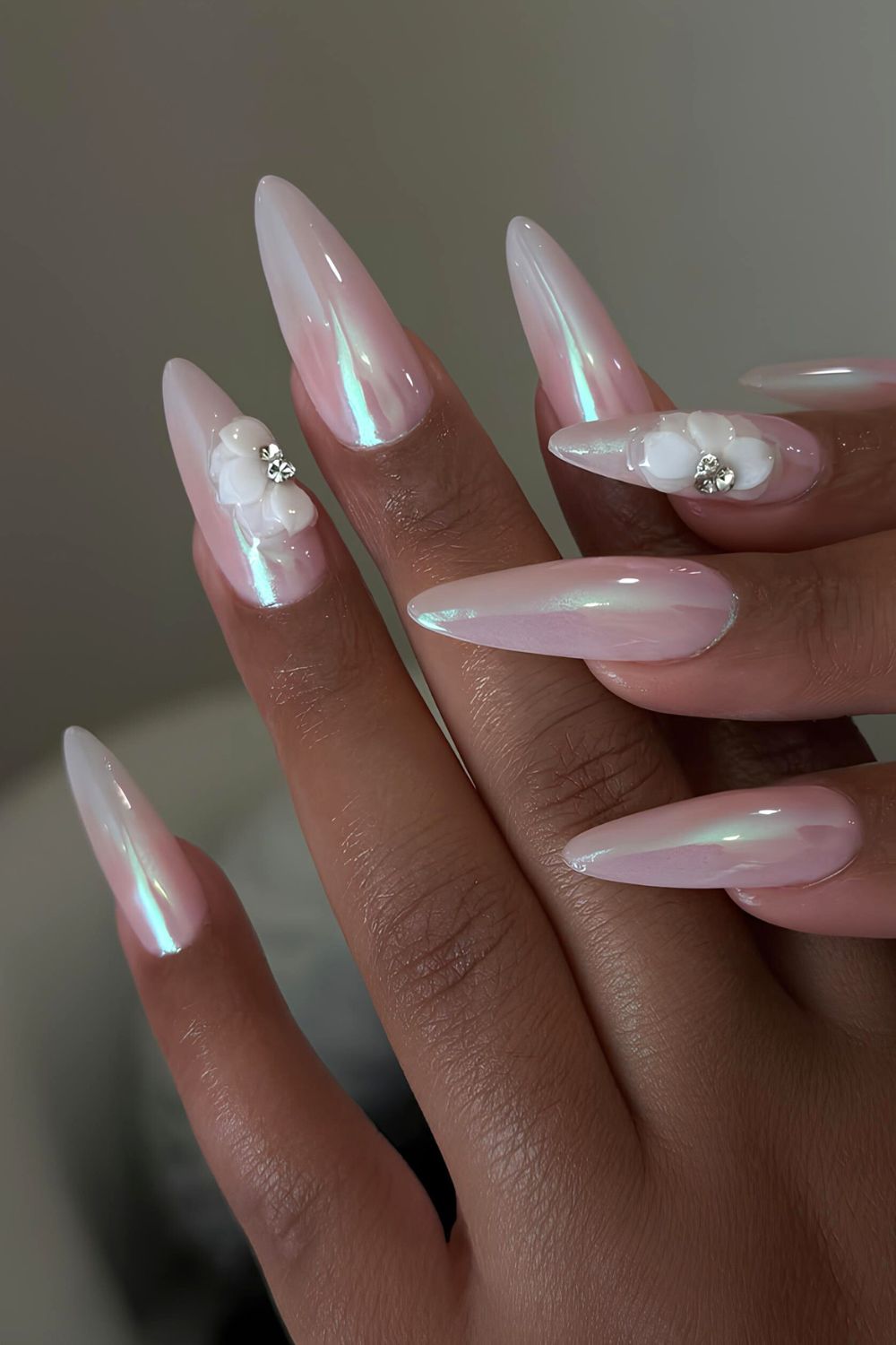 White chrome nails with aurora effect and 3d florals