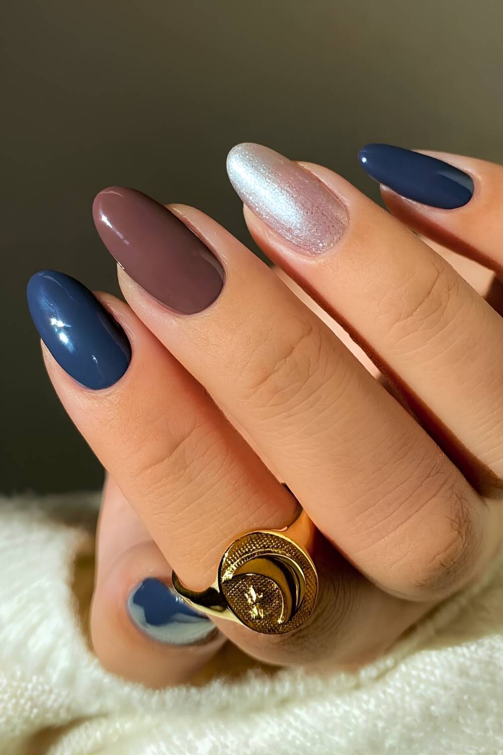 Almond brown and blue nails with gold accent