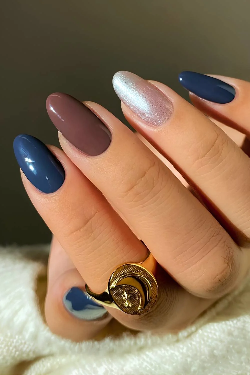 Almond brown and blue nails with gold accent