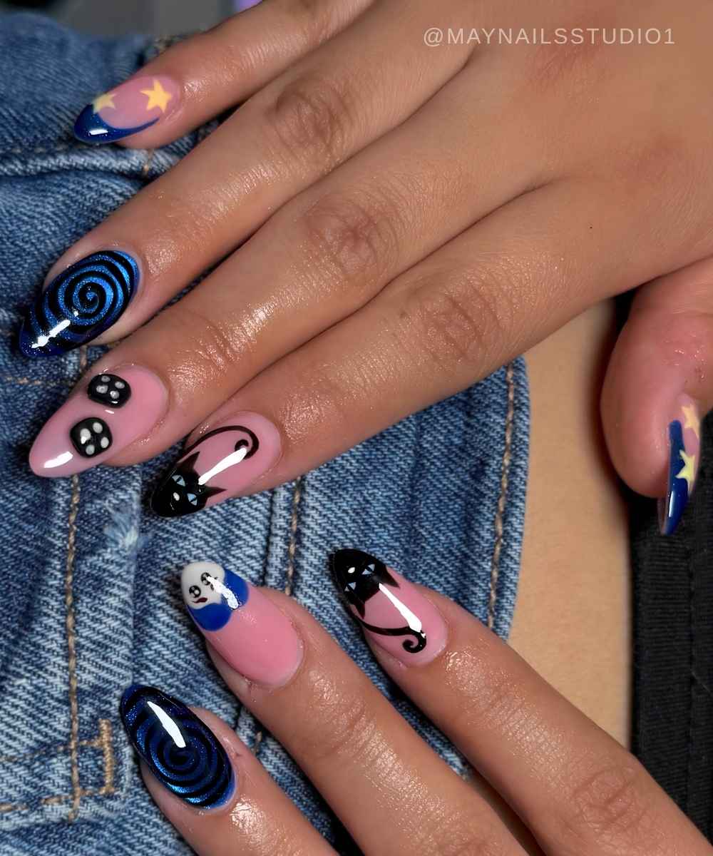 Black and blue nails with Coraline inspired art