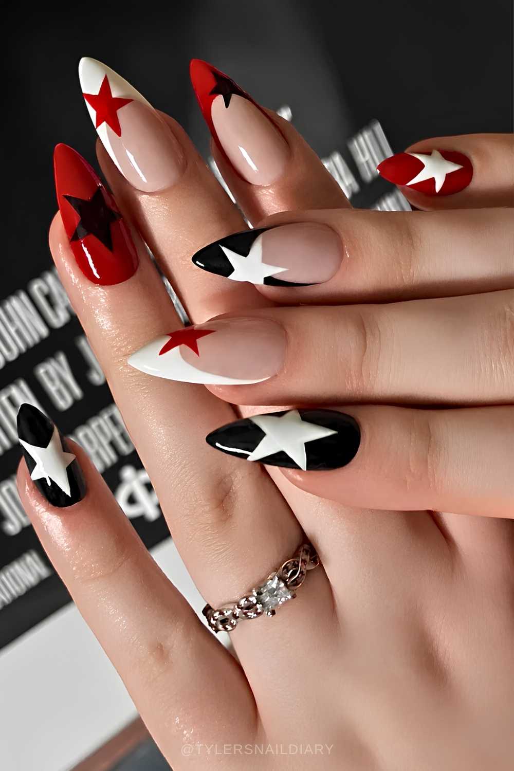 Black and red mani with star accents