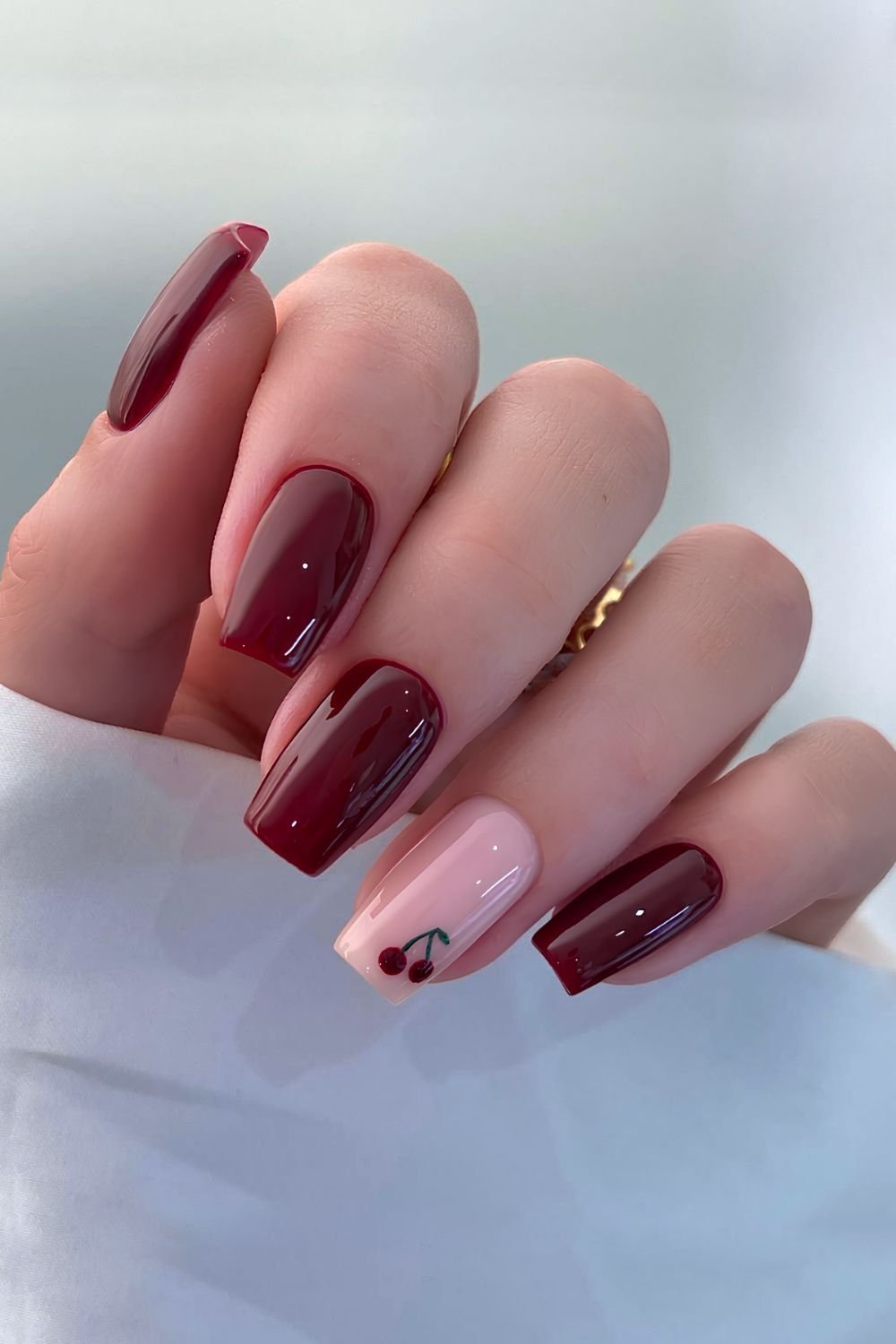 Chery red nails with pink accent and cherry art