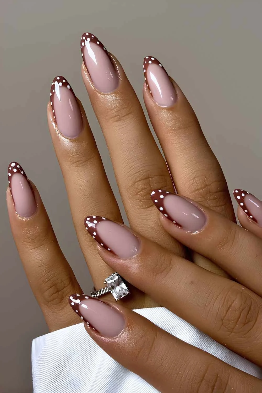 Chestnut brown French mani with polka dots