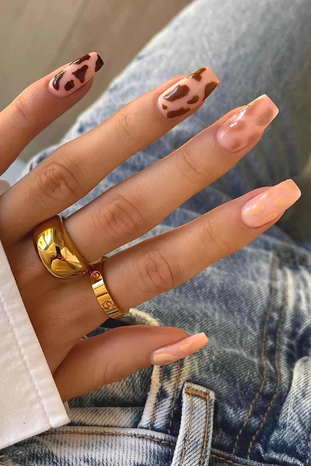 Cow print nails in different brown shades
