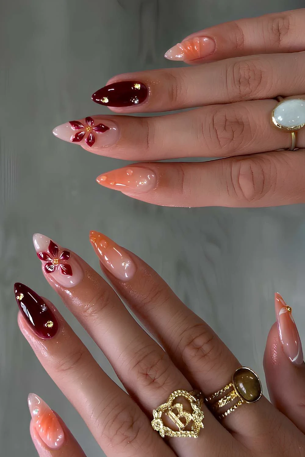 Deep red and burnt orange floral nails