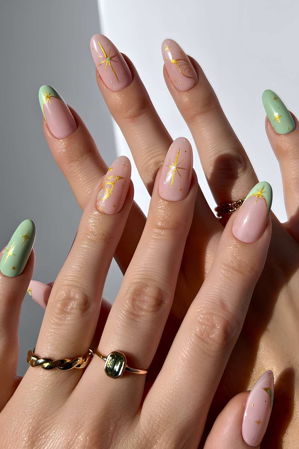 Light green nails with gold celestial art