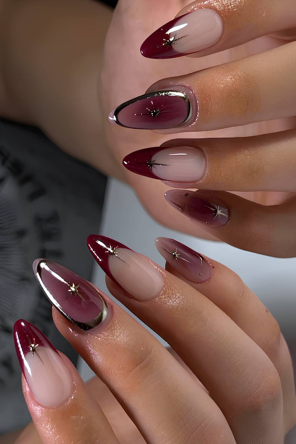 Maroon French mani with celestial accents