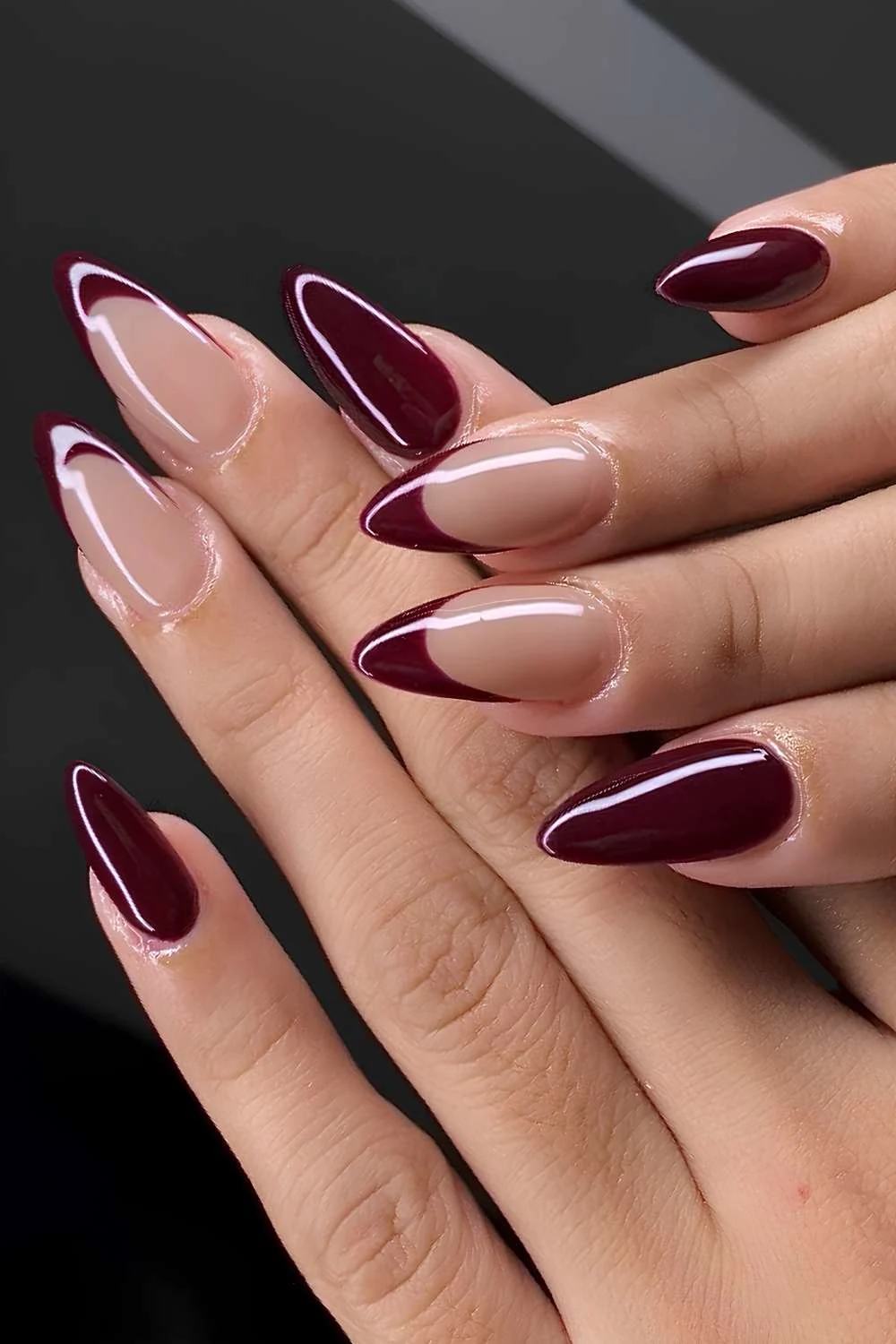 Maroon manicure with accent French tips