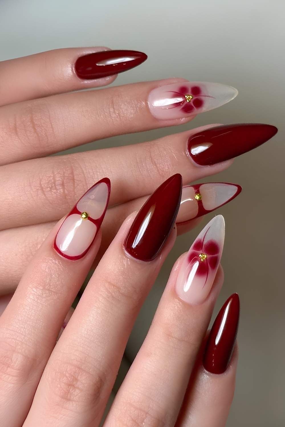 Maroon nails with blooming gel flowers