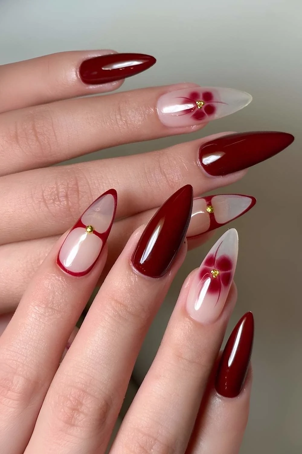 Maroon nails with blooming gel flowers