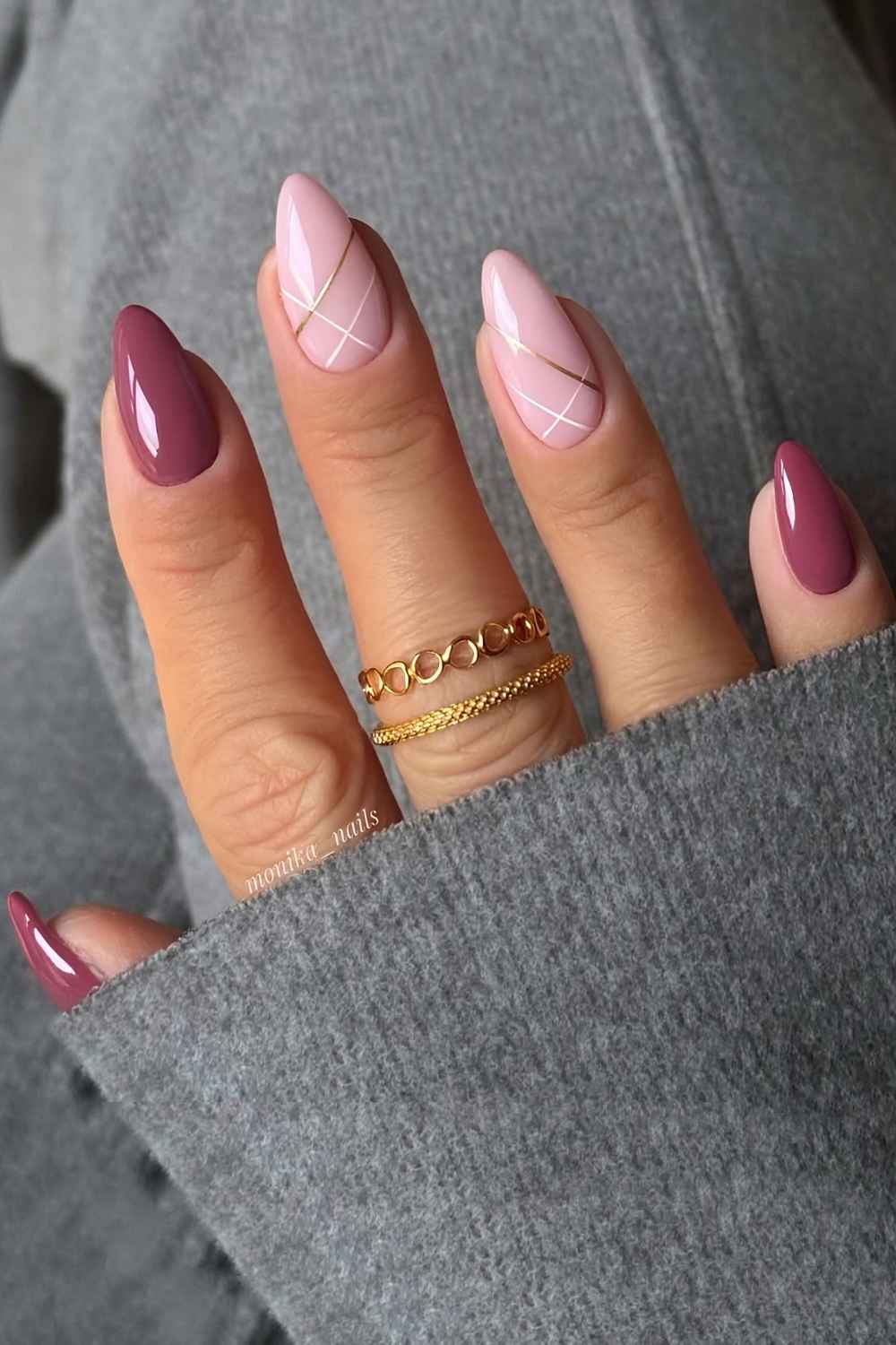 Mauve and pink nails with white and gold line accents