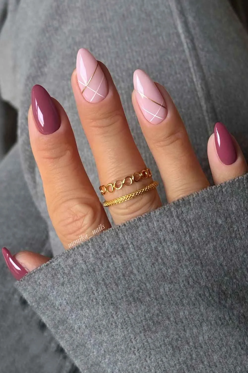 Mauve and pink nails with white and gold line accents