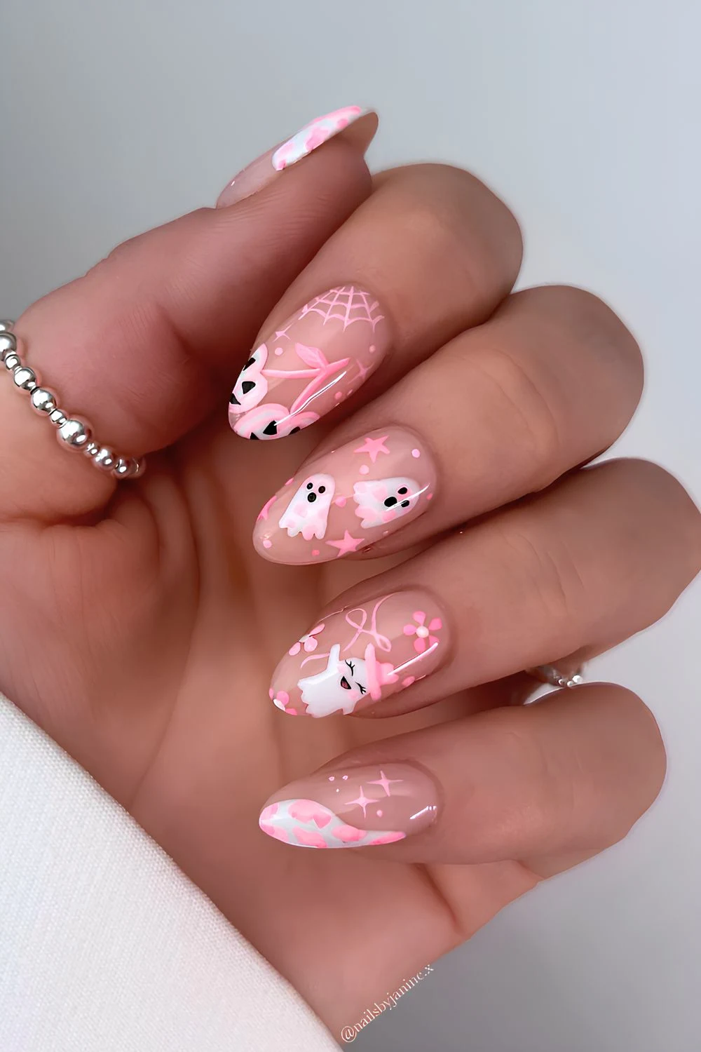 Milky nails with cute pink Halloween art