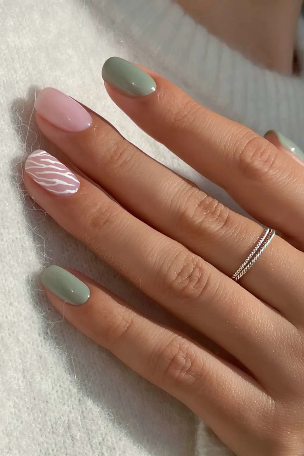 Moss green nails with white animal print accent