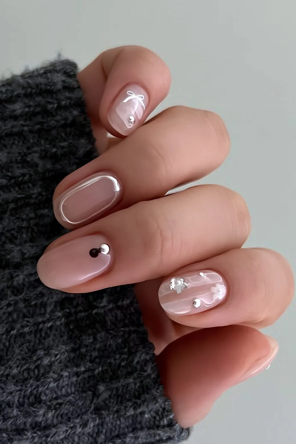 Natural squoval mani with chrome, floral and bow accents