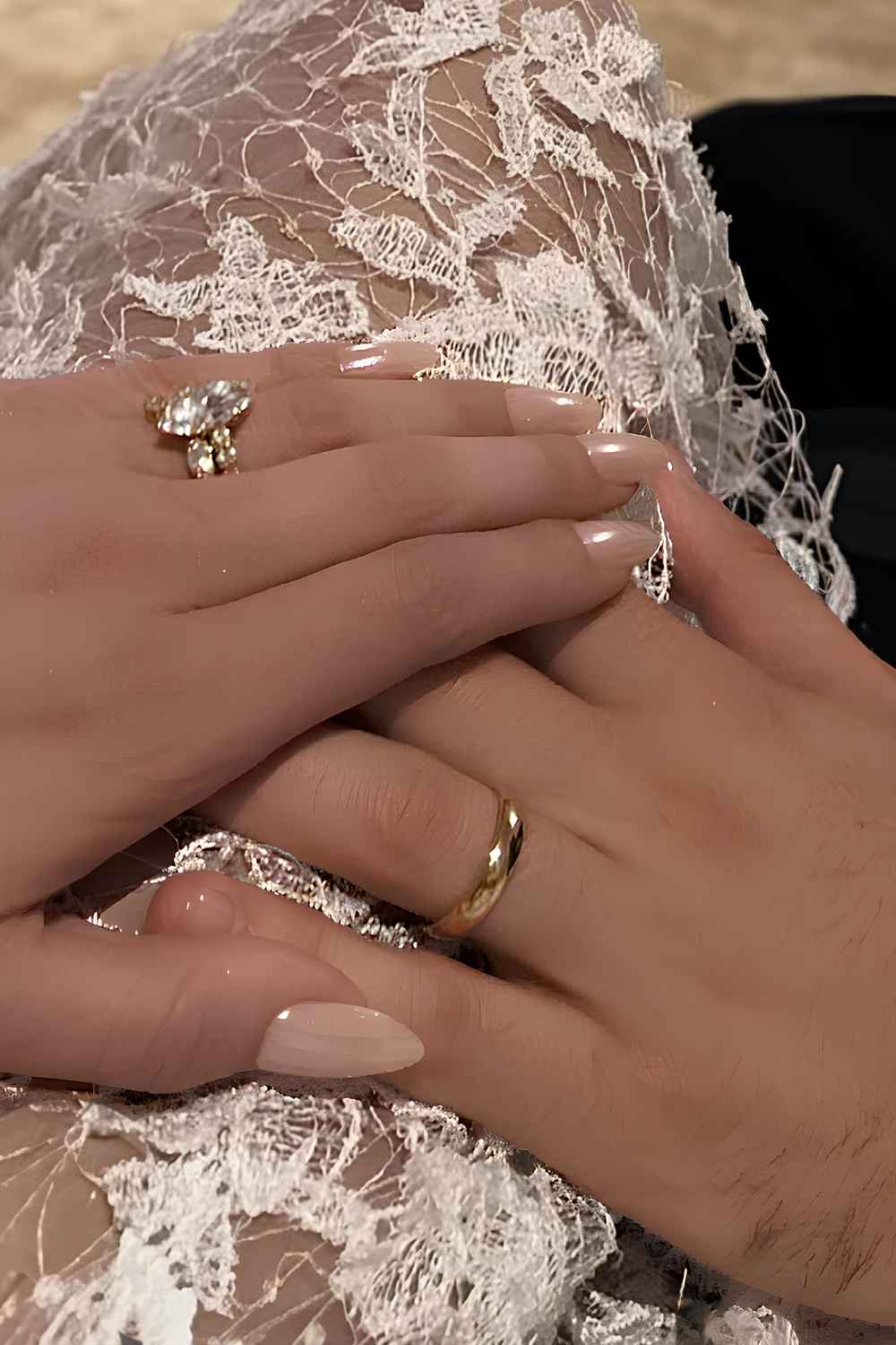 Off-white almond nails with pearly chrome finish