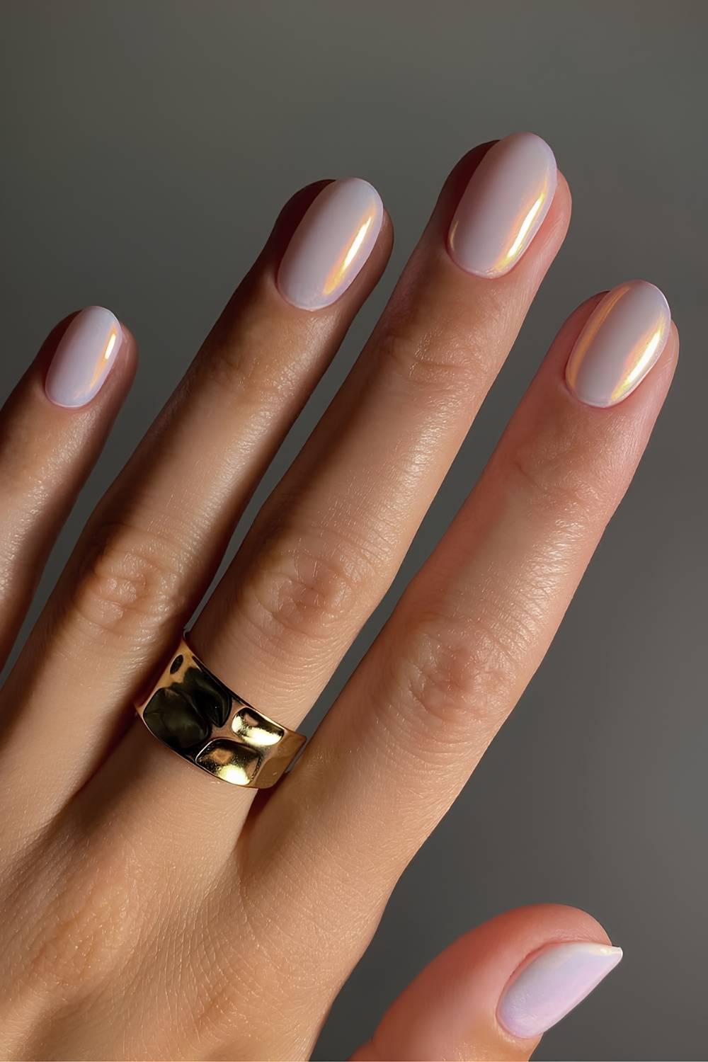 Opal-inspired nails with chrome effect